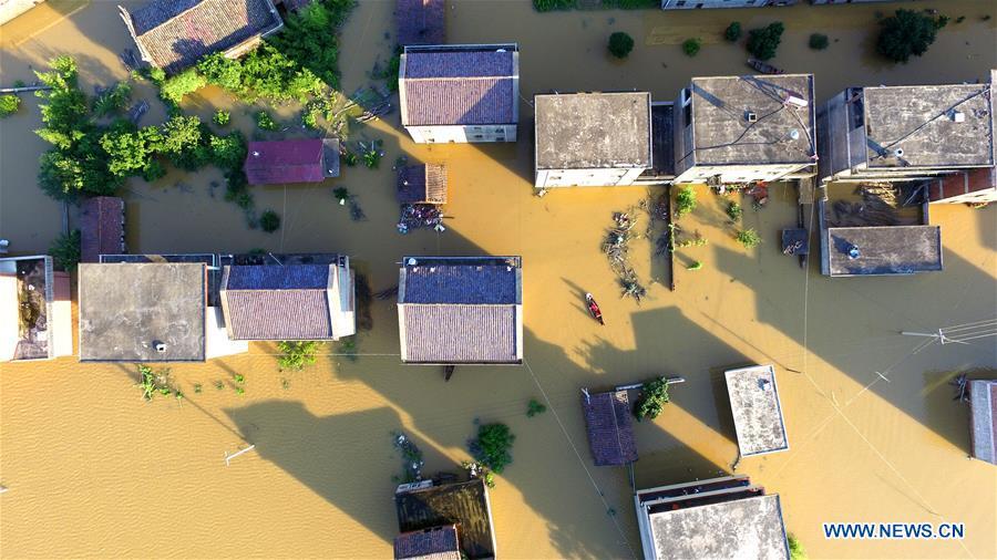 Aerial photo taken on July 8, 2018 shows the flooded area in Qiaoxi Village of Maxu Township of Fuzhou City, east China\'s Jiangxi Province. Flood caused by heavy rain damaged crops and housings in Maxu Township and rescue groups were set up to help the affected people. (Xinhua/He Jianghua)