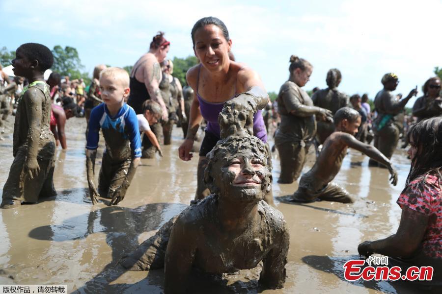 Nathan Jamerson, 9, plays in the mud pit during Mud Day at the Nankin Mills Park, July 10, 2018, in Westland, Mich. The annual day sponsored by the Wayne County Parks takes place in a 75\' x 150\' giant mud pit that gives children the opportunity to get down and dirty at one of the messiest playgrounds Southeast Michigan has ever seen. (Photo/Agencies)
