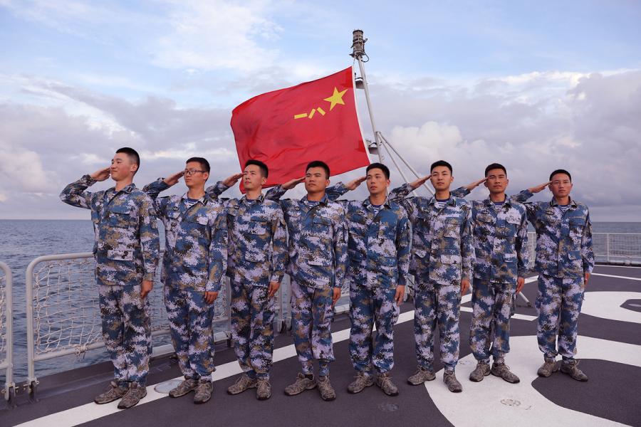 Students from Dalian Naval Academy take a graduation photo on the deck of a training vessel during their graduation practice in June 2018. (Photo provided to chinadaily.com.cn)
