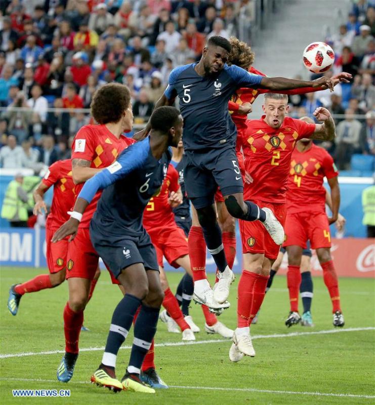 Olivier Giroud (L) of France shoots during the 2018 FIFA World Cup semi-final match between France and Belgium in Saint Petersburg, Russia, July 10, 2018. (Xinhua/Lu Jinbo)