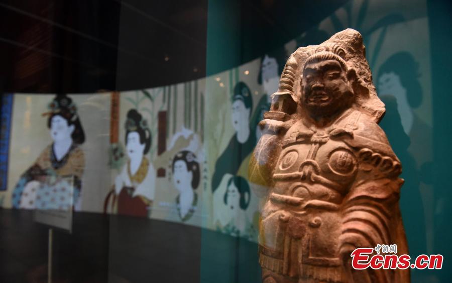 Visitors look at the Digital Dunhuang - Tales of Heaven and Earth exhibition at the Hong Kong Heritage Museum, July 10, 2018. Jointly presented by the Hong Kong Leisure and Cultural Services Department and the Dunhuang Academy, the exhibition highlights the achievements of digitization projects at the Dunhuang Academy, together with a presentation of unearthed artefacts, the grotto art of Dunhuang, and the latest multimedia technology. The Dunhuang Academy has made substantial achievements in digitization, 3D scanning and virtual reality representation of the Dunhuang relics. (Photo: China News Service/Zhang Wei)