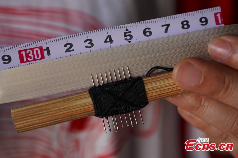<?php echo strip_tags(addslashes(Yang Dujuan shows the tools she uses to make QR codes from bamboo strips in Sansui County, Southwest China’s Guizhou Province, July 11, 2018. A former migrant worker, Yang began to lead other villagers to make bamboo creations in 2014, trained more than 300 locals, and has now reached annual sales surpassing one million yuan ($150,000). In 2018, she began offering bamboo strips made into QR codes for clients, a creative combination of traditional bamboo weaving and the emerging popularity of codes that smartphone users can scan to access rich information. Her creation priced at 200 yuan for products was popular online. (Photo: China News Service/He Junyi))) ?>