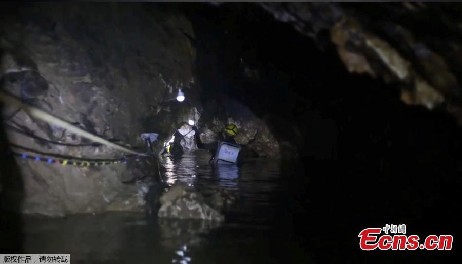 This undated image from video released via the Thai NavySEAL Facebook Page on July 11, 2018, shows rescuers hold an evacuated boy inside the Tham Luang Nang Non cave in Mae Sai, Chiang Rai province, in northern Thailand. A daring rescue mission in the treacherous confines of a flooded cave in northern Thailand has saved all 12 boys and their soccer coach who were trapped deep within the labyrinth, ending a grueling 18-day ordeal that claimed the life of an experienced volunteer diver and riveted people around the world. (Photo/Agencies)