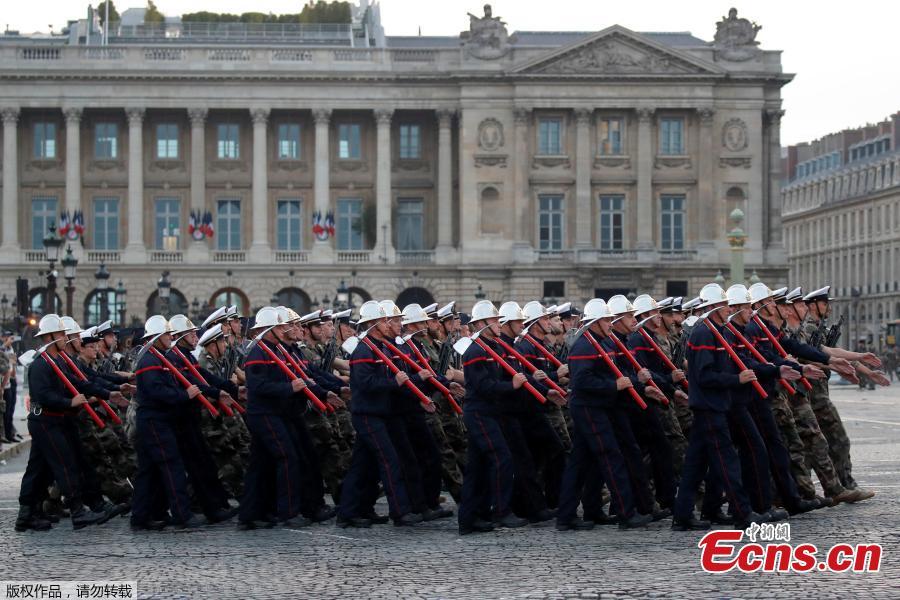 <?php echo strip_tags(addslashes(French firefighters and navy soldiers attend a rehearsal of the Bastille day parade on the Champs-Elysees in Paris, France, July 12, 2018. (Photo/Agencies))) ?>