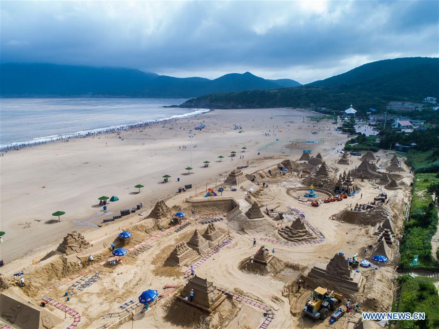 This aerial photo taken on July 12, 2018 shows sand sculpture works to be shown at the upcoming 2018 Zhoushan International Sand Sculpture Festival in Zhoushan, east China\'s Zhejiang Province. The works of over 30 sand sculptors worldwide will be officially made available to public visitors on July 21. (Xinhua/Xu Yu)