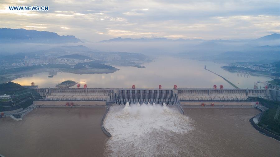 <?php echo strip_tags(addslashes(Three Gorges Reservoir increases its discharge volume in Yichang City, central China's Hubei Province, July 13, 2018. The second flood peak of the Yangtze River this year is forming in its upper reaches. Peak flow at the Three Gorges reservoir is expected to reach 61,000 cubic meters per second on Saturday. (Xinhua/Zheng Jiayu))) ?>