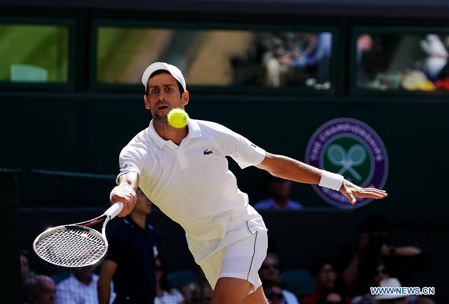 Novak Djokovic of Serbia hits a return during the men\'s singles final match against Kevin Anderson of South Africa at the Wimbledon Championships 2018 in London, Britain, on July 15, 2018. (Xinhua/Guo Qiuda)
