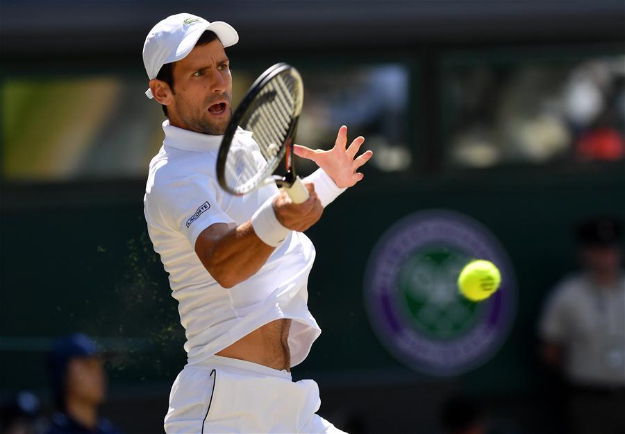 Novak Djokovic of Serbia hits a return during the men\'s singles final match against Kevin Anderson of South Africa at the Wimbledon Championships 2018 in London, Britain, on July 15, 2018. (Xinhua/Guo Qiuda)