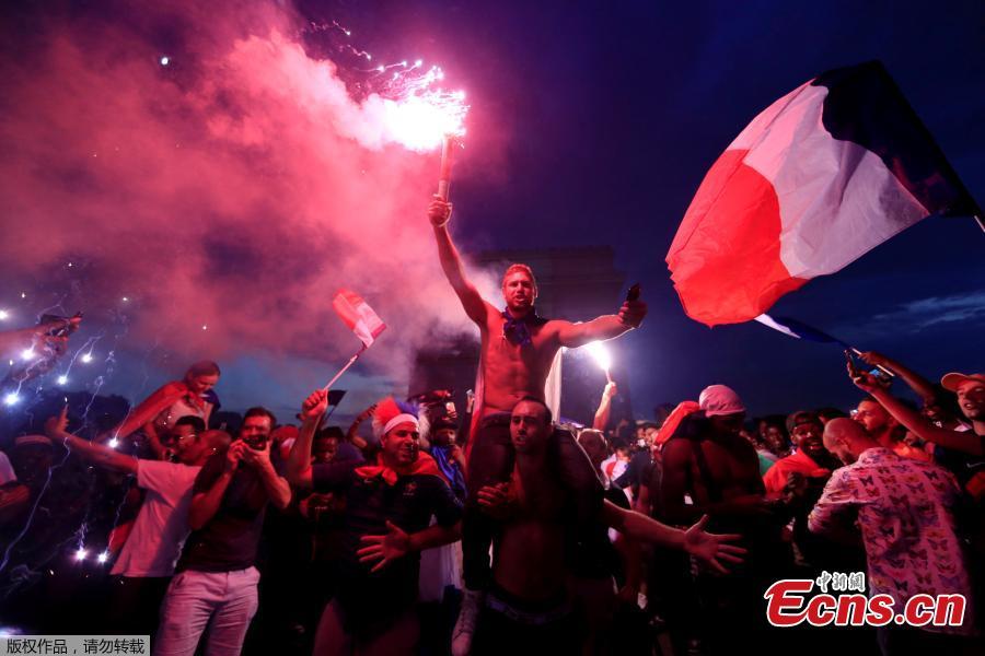 France fans celebrate on the Champs-Elysees avenue after France win the World Cup final, July 15, 2018. (Photo/Agencies)
