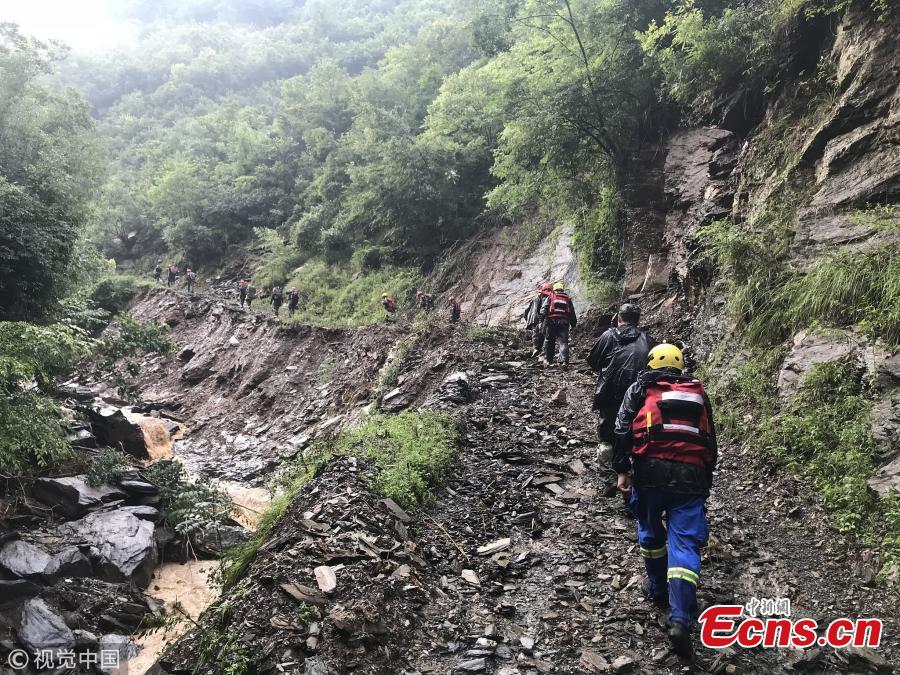 Rescuers help people affected by heavy rain and floods in Lueyang County, Northwest China’s Shaanxi Province. Six hours of heavy rain on July 13 and 14 caused landslides in the county, cutting off power and telecommunication and transportation links in many areas, and causing a direct economic loss of 193 million yuan ($28.8 million). Hundreds of firefighters and police officers, including armed police, have joined search and rescue efforts. Some police officers had to walk on foot for 57 kilometers. (Photo/VCG)