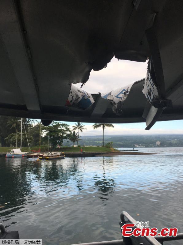 This photo provided by the Hawaii Department of Land and Natural Resources shows damage to the roof of a tour boat after an explosion sent lava flying through the roof off the Big Island of Hawaii Monday, July 16, 2018, injuring at least 23 people. The lava came from the Kilauea volcano, which has been erupting from a rural residential area since early May. (Photo/Agencies)