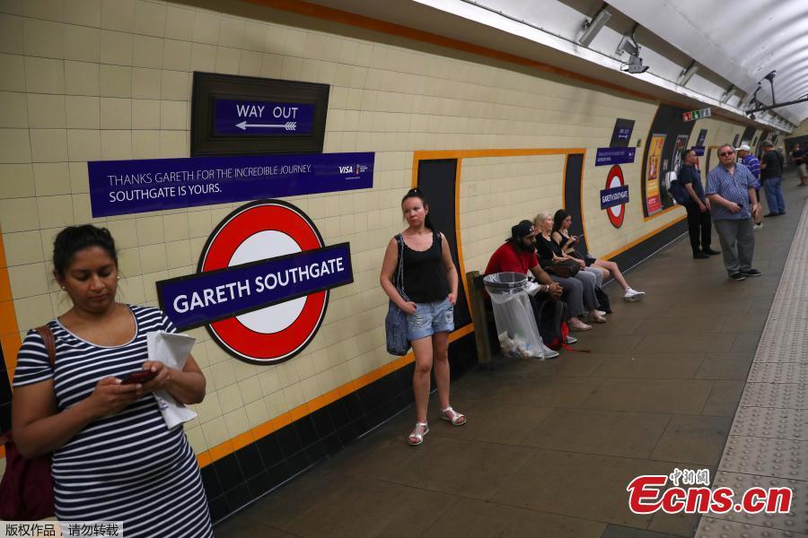 Passengers wait at Southgate Underground Station, temporarily renamed as \'Gareth Southgate\' in honor of England soccer team manager Gareth Southgate, in London, Britain, July 16, 2018. (Photo/Agencies)