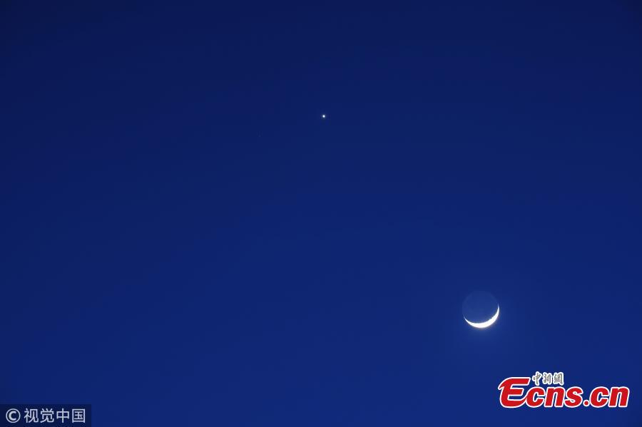 <?php echo strip_tags(addslashes(Venus (above) appears in the night sky near a crescent moon on July 15, 2018 in Bogota, Colombia. The conjunction of the planet Venus was seen next to the crescent moon and the regulus star from sunset to sunrise. (Photo/VCG))) ?>