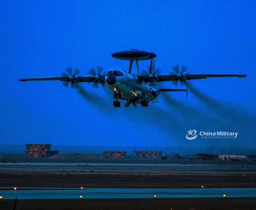 <?php echo strip_tags(addslashes(An airborne early warning (AEW) aircraft takes off at night for a sortie during the 