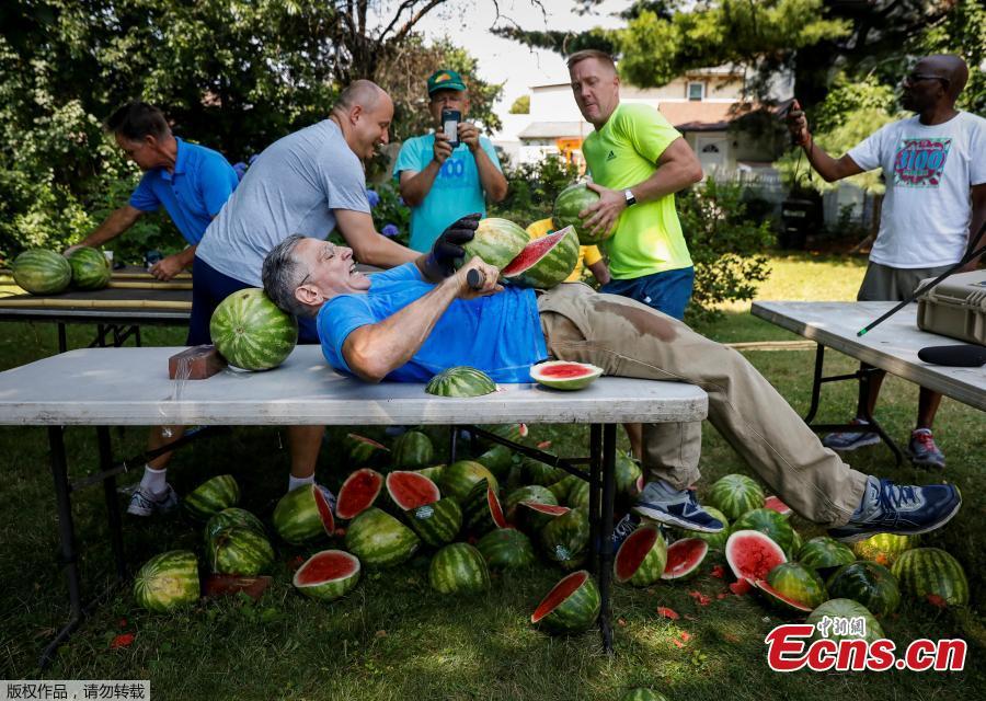 Ashrita Furman, who holds more Guinness World Records than anyone, attempts to set a new record for slicing the most watermelons in half on his own stomach in one minute in New York City, U.S., July 17, 2018. (Photo/Agencies)
