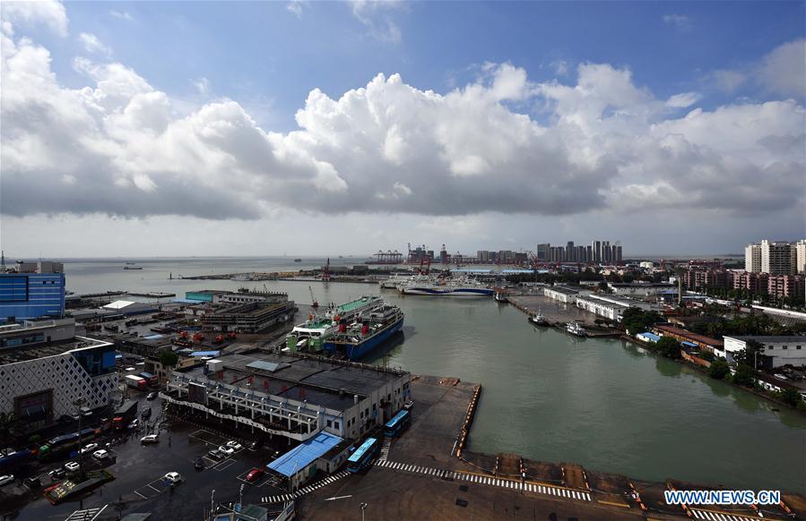 Photo taken on July 17, 2018 shows passenger ferries berth at the Haikou Harbor in Haikou, south China\'s Hainan Province. Ferry services on the Qiongzhou Strait in south China have been halted as of Tuesday afternoon as a typhoon is fast approaching the southern provinces of Hainan and Guangdong, local authorities have said. Son-Tinh, the ninth typhoon this year, is expected to make landfall in Hainan and Guangdong on Wednesday morning, according to China\'s National Meteorological Center. (Xinhua/Guo Cheng)