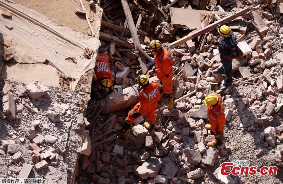 Rescue workers look for survivors amidst the rubble at the site of a collapsed residential building at Shah Beri village in Greater Noida, India, July 18, 2018. Police said that most of the people feared trapped are laborers working at the site. India Today reported that a National Disaster Response Force (NDRF) team has also been rushed to the spot. The news channel further said that as many as 20 people are feared trapped in the debris. (Photo/Agencies)