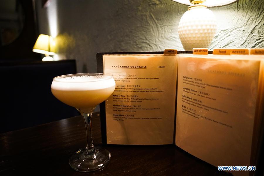 Photo taken on July 5, 2018 shows Lucky Lychee, a vodka-based cocktail drink invented by Cafe China in New York, the United States. Walking in the bustling street of midtown Manhattan, you may not notice Cafe China if there weren\'t so many people waiting for seats outside the Chinese restaurant. Although the space is limited and decoration not so luxury, Cafe China has won Michelin one star for six consecutive years from 2012 to 2017. Wang Yiming and Zhang Xian, a couple from China, quit their well-paid financial jobs in New York and opened Cafe China with the ambition to provide authentic Sichuan cuisine along with a comfortable dining environment. They decided not to sell American-Chinese dishes like most Chinese restaurants did at that time. Meanwhile, the couple decorated the place with items such as vintage posters, antique cameras and lamps to create an old Shanghai style. At the beginning, their idea was strongly opposed by many friends and even their staff, as the American-Chinese food was the easiest way to make money at that time. However, it surprised them that many Americans swarmed to Cafe China with curiosity for decent Chinese dishes and the unique dining environment as soon as the restaurant just opened. The couple believed the success of Cafe China resulted from not only the appeal of authentic Chinese food but also the sophisticated Chinese culture behind it. \