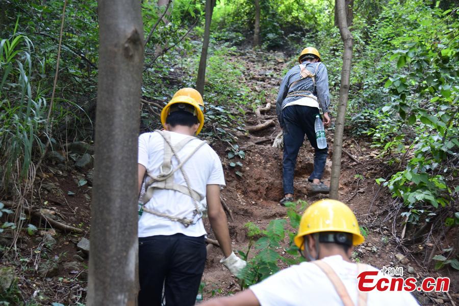 <?php echo strip_tags(addslashes(A renovation project is underway to reinforce a 100-meter-high cliff on Malu Mountain in Liuzhou City, South China’s Guangxi Zhuang Autonomous Region, July 19, 2018. Liuzhou, known for its karst formations, allocates funds each year to check and reduce the risks of potential landslides that might threaten local residents. (Photo: China News Service/Wang Yizhao))) ?>