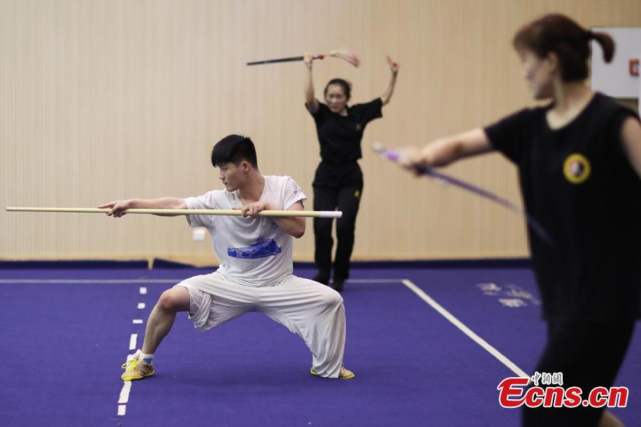 <?php echo strip_tags(addslashes(Members of the Nanjing Agricultural University Martial Arts Team train for the upcoming China University Students Martial Arts Routine Championship in Nanjing City, East China’s Jiangsu Province, July 19, 2018, as temperatures hit approximately 35 degrees centigrade. (Photo: China News Service/Yang Bo))) ?>