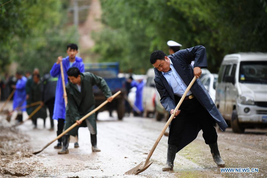 <?php echo strip_tags(addslashes(People clear the mud at flood-hit Chenhe Village of Dongxiang Autonomous County in Linxia Hui Autonomous Prefecture, northwest China's Gansu Province, July 20, 2018. About 1.08 million people in Gansu Province were affected by rain-triggered floods, with 12 deaths, four people missing and 27,000 people evacuated. (Xinhua/Chen Bin))) ?>