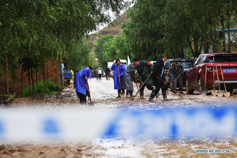 <?php echo strip_tags(addslashes(People clear the mud at flood-hit Chenhe Village of Dongxiang Autonomous County in Linxia Hui Autonomous Prefecture, northwest China's Gansu Province, July 20, 2018. About 1.08 million people in Gansu Province were affected by rain-triggered floods, with 12 deaths, four people missing and 27,000 people evacuated. (Xinhua/Chen Bin))) ?>