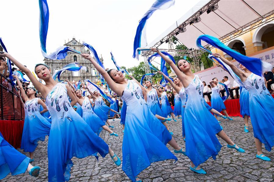 Dancers perform during a parade of an international youth dance festival in Macao, south China, July 21, 2018. A total of 27 dance teams participated in the event here on Saturday. (Xinhua/Cheong Kam Ka)