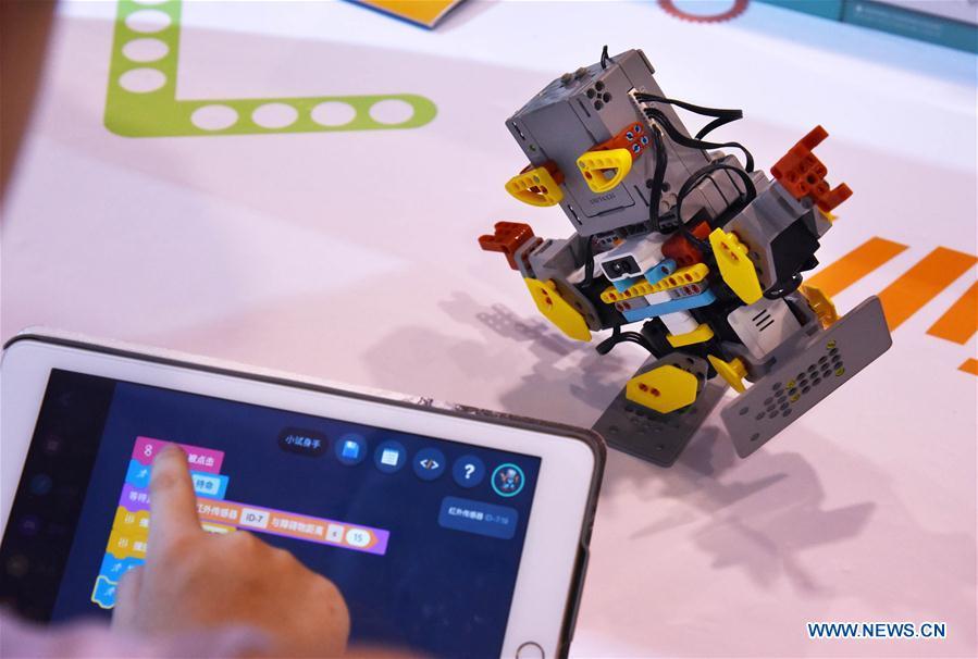 <?php echo strip_tags(addslashes(A visitor operates a robot during the 2018 China International Consumer Electronics Show in Qingdao, east China's Shandong Province, July 21, 2018. The four-day electronics show kicked off on Friday. (Xinhua/Li Ziheng))) ?>