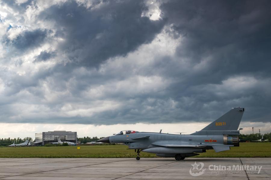 A J-10A fighter jet attached to the Chinese PLA Air Force taxies on runway after landing at the airport on July 21. All aircraft of the PLA Air Force to participate in the \