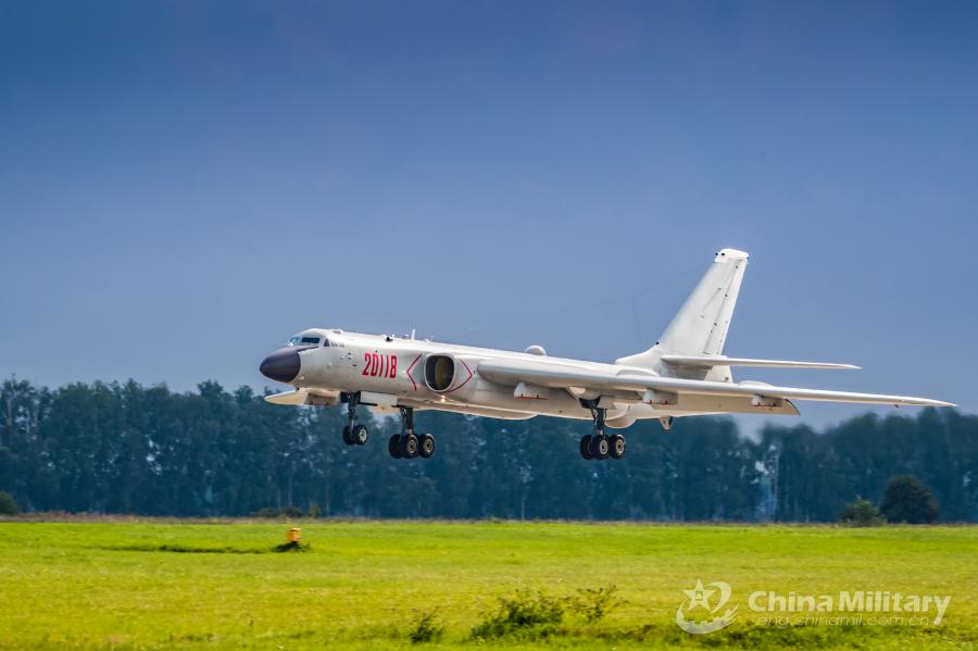 An H-6K bomber attached to the Chinese PLA Air Force prepares to land at the airport on July 20. All aircraft of the PLA Air Force to participate in the \