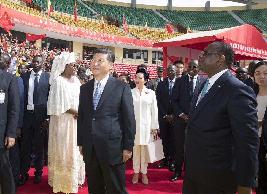 Chinese President Xi Jinping and his Senegalese counterpart Macky Sall attend a handover ceremony of the National Wrestling Arena built with Chinese aid in Dakar, Senegal, July 22, 2018. (Xinhua/Wang Ye)