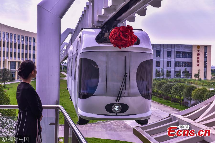 <?php echo strip_tags(addslashes(A suspension railway with carriages resembling pandas takes a trial run in Dayi County, Chengdu City, Southwest China’s Sichuan Province, July 21, 2018. Chengdu has announced it will start construction on an elevated monorail linking Dayi Station on the Chengdu?Pujiang Intercity Railway and Anren Town in Dayi County. The 11.2-kilometer-long tourist railway will have a total investment of 2.178 billion yuan ($321 million), with construction expected to be complete in 17 months. Chengdu will experiment with the ‘sky train’ project while promoting its transportation network. (Photo/VCG))) ?>