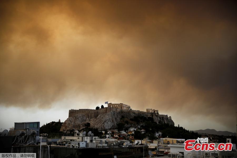 <?php echo strip_tags(addslashes(Smoke from a wildfire burning outside Athens is seen over the Parthenon temple atop the Acropolis hill in Athens, Greece, July 23, 2018. At least 20 people died and more than 100 were injured on Monday as a wildfire swept through a small resort town in eastern Greece with many victims trapped by flames as they fled. (Photo/Agencies))) ?>