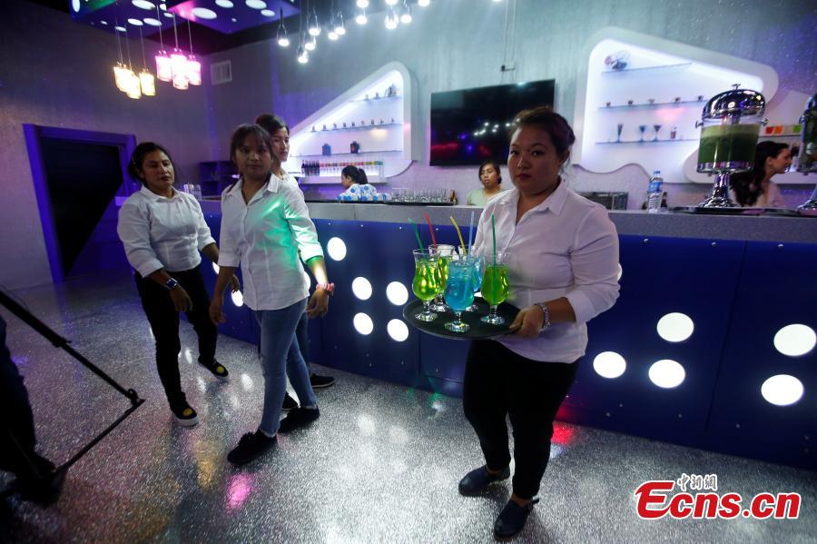 <?php echo strip_tags(addslashes(Waitresses serve an order at Luxury Time, the city's first women-only restaurant, in Erbil, Iraq July 17, 2018. (Photo/Agencies))) ?>
