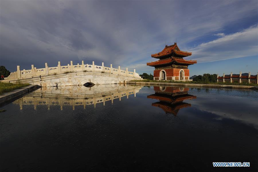 Photo taken on July 24, 2018 shows a stele tower and its water reflection at Dongling Imperial Mausoleum scenic spot in Zunhua City, north China\'s Hebei Province. (Xinhua/Liu Mancang)