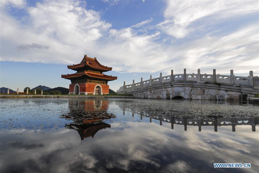 Photo taken on July 24, 2018 shows a stele tower and its water reflection at Dongling Imperial Mausoleum scenic spot in Zunhua City, north China\'s Hebei Province. (Xinhua/Liu Mancang)