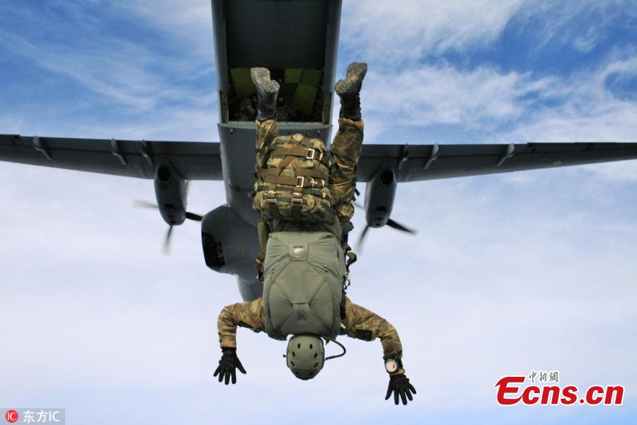 A member of Turkey’s special operations forces \'Maroon Berets\' jumps from a military plane within routine military parachute trainings at the Sivrihisar district of Eskisehir, Turkey, July 25, 2018. (Photo/IC)