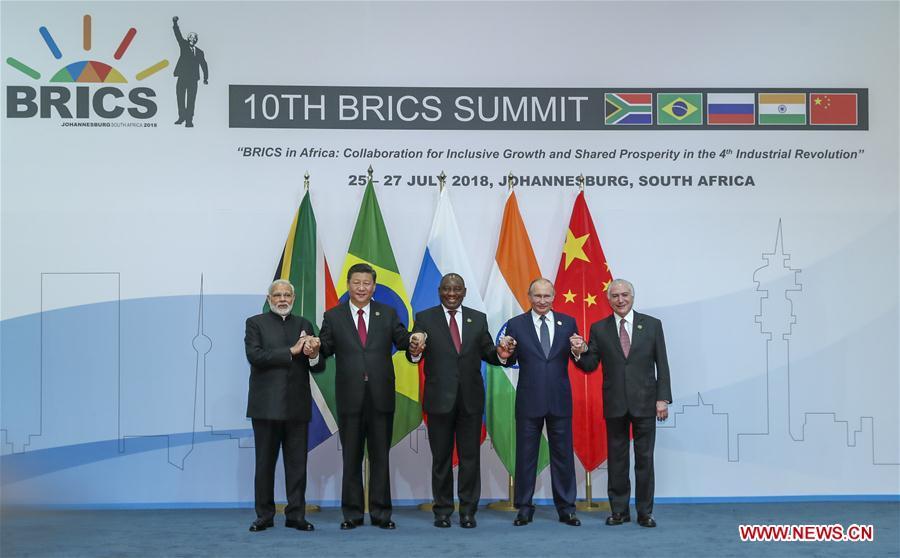 <?php echo strip_tags(addslashes(Chinese President Xi Jinping (2nd L), Brazilian President Michel Temer (1st R), Russian President Vladimir Putin (2nd R), Indian Prime Minister Narendra Modi (1st L) and South African President Cyril Ramaphosa pose for a group photo during the Plenary Session of the 10th BRICS summit in Johannesburg, South Africa, July 26, 2018. (Xinhua/Xie Huanchi))) ?>