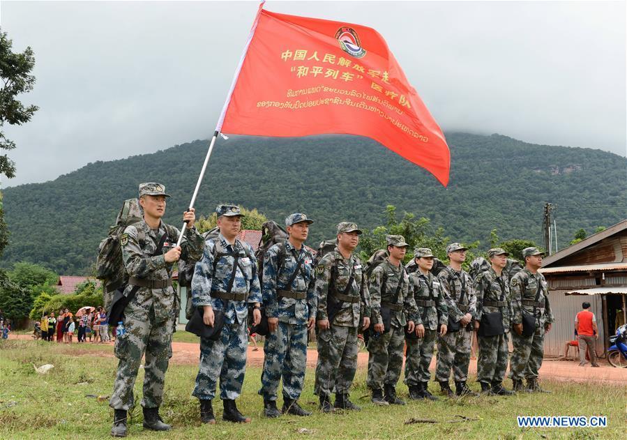 A Chinese People\'s Liberation Army (PLA) medical team arrive at the flooded-area in Attapeu, Laos, July 26, 2018. A medical contingent from the Chinese People\'s Liberation Army (PLA), which is on the \