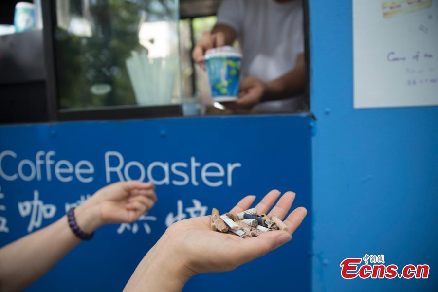 <?php echo strip_tags(addslashes(Food truck owner Fei Xiang exchanges free coffee for ten cigarette butts, picked up by customers in Flushing, New York City, U.S., July 26, 2018. Fei’s food truck offered customers free coffee in exchange for ten cigarette butts, picked up from around the community, as an initiative to improve the local environment. Fei said he delivered about five to ten cups of free coffee a day. (Photo: China News Service/Liao Pan))) ?>