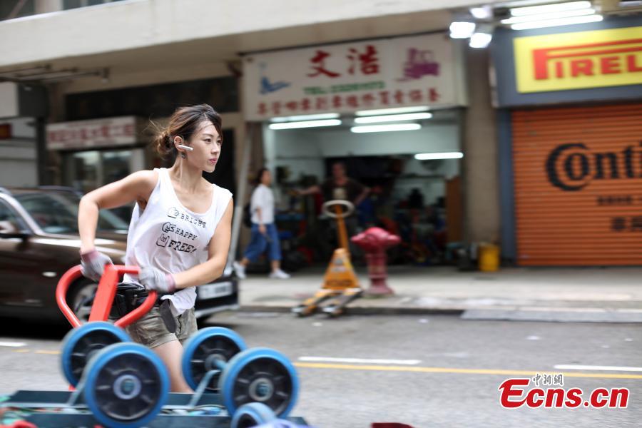 <?php echo strip_tags(addslashes(Zhu delivers goods in Hong Kong. Zhu worked as a hotel security guard and also as a lifeguard in the past, but she eventually choses the transportation industry. (Photo: China News Service/Hong Shaokui))) ?>