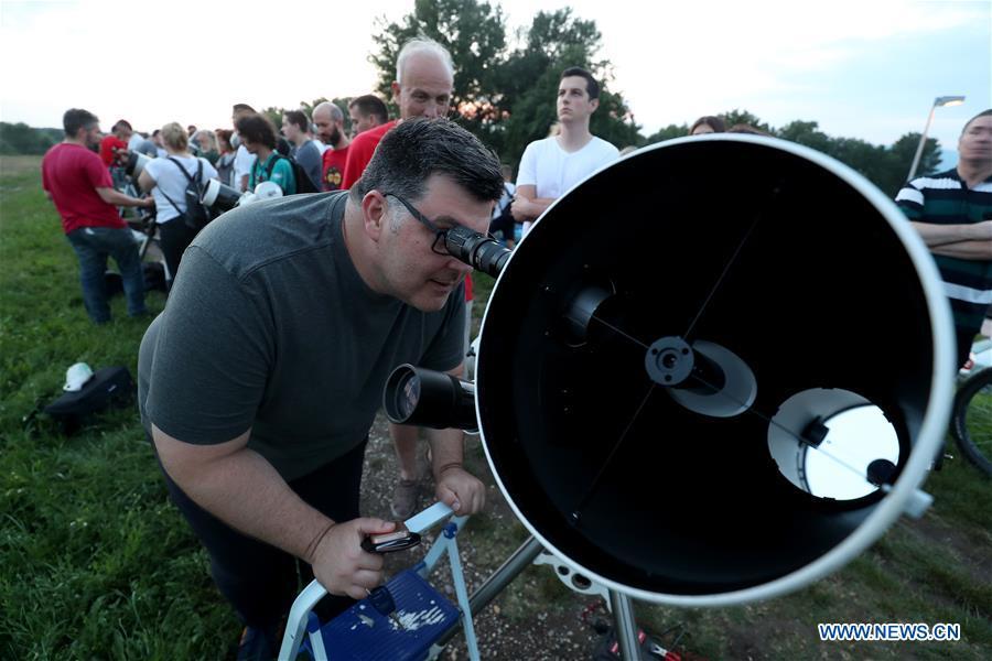 <?php echo strip_tags(addslashes(People watch the longest total lunar eclipse of the century at Jarun Lake in Zagreb, capital of Croatia, on July 27, 2018. (Xinhua/Igor Kralj))) ?>