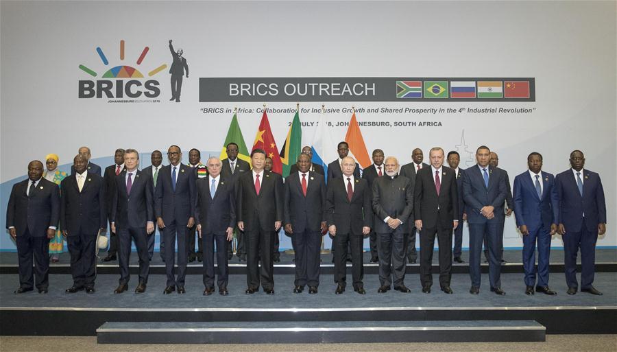 <?php echo strip_tags(addslashes(The BRICS leaders pose for a group photo with leaders or representatives of the leaders from invited countries, and heads of regional organizations in Africa in Johannesburg, South Africa, July 27, 2018. Chinese President Xi Jinping made a speech to an outreach dialogue grouping leaders from the BRICS, the 
