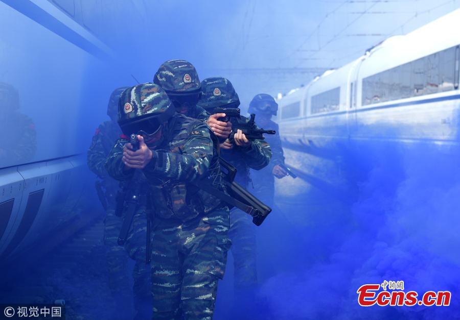 Armed police officers take part in a drill that simulated a hostage-taking crisis on a high-speed train in Hefei City, East China’s Anhui Province, July 30, 2018. The drill aimed to enhance preparedness against transportation emergencies. (Photo/VCG)