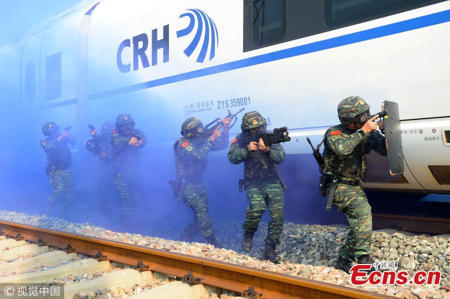 Armed police officers take part in a drill that simulated a hostage-taking crisis on a high-speed train in Hefei City, East China’s Anhui Province, July 30, 2018. The drill aimed to enhance preparedness against transportation emergencies. (Photo/VCG)