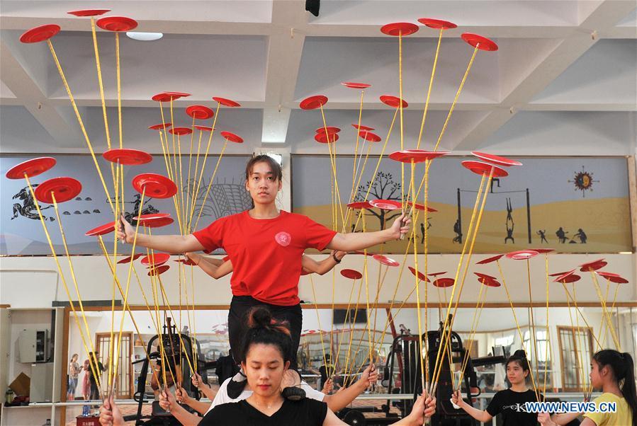 Students from Laos practise in Wuqiao Acrobatic Art School in Cangzhou, north China\'s Hebei Province, July 30, 2018. Wuqiao county is known as \