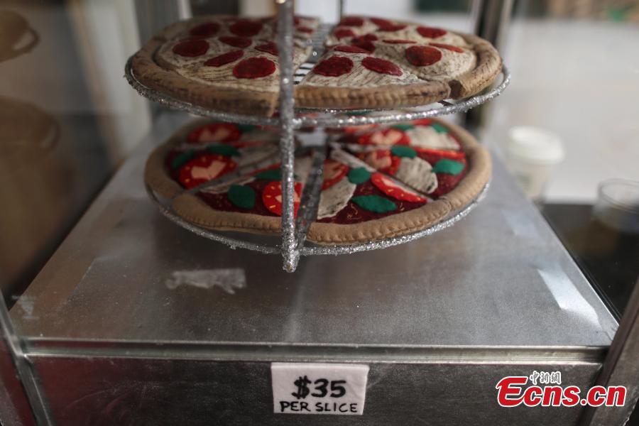 <?php echo strip_tags(addslashes(Pizza made from felt is seen at the art installation of British artist Lucy Sparrow, 32, in Los Angeles, California, U.S. July 31, 2018. (Photo/Agencies))) ?>