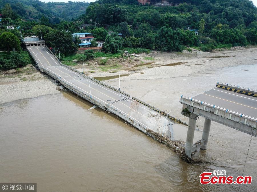 The Mingjiang River First Bridge collapses in Meishan City, Southwest China’s Sichuan Province, July 27, 2018. The bridge collapsed 28 minutes after police stopped traffic from crossing it. The bridge opened to traffic in May 1994. No one was injured in the incident. (Photo/VCG)