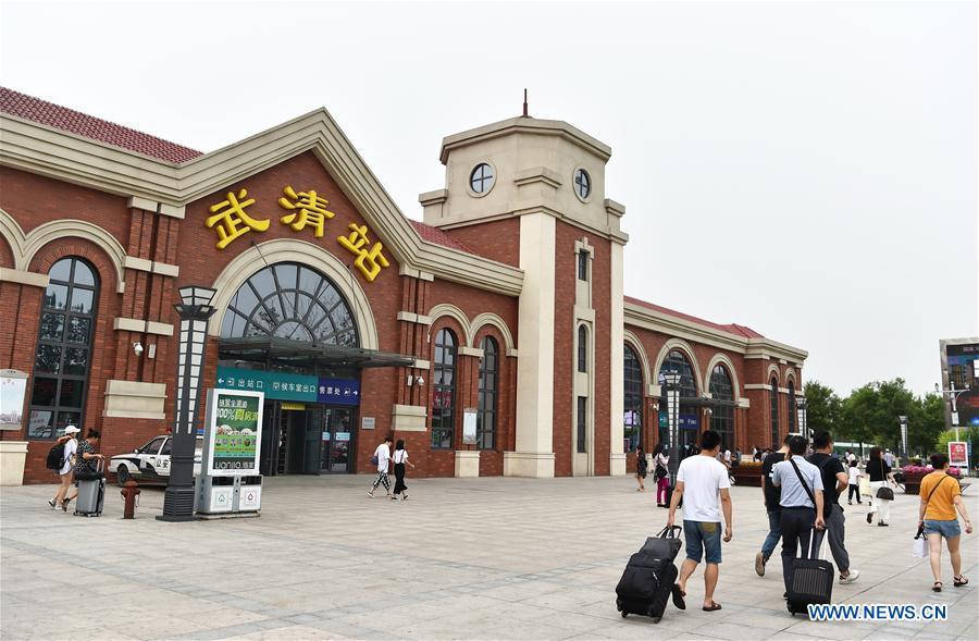 Photo taken on July 11, 2018 shows the Wuqing Railway Station in Tianjin, north China. On Aug. 1, 2008, the Beijing-Tianjin high-speed train service opened China\'s first high-speed railway line. The length of high-speed railway lines in China increased from zero 10 years ago to 25,000 km by 2017, accounting for 66 percent of the world\'s total. (Xinhua/Li Ran)