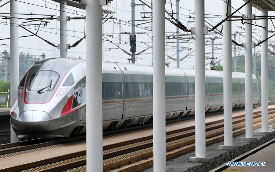 Photo taken on July 11, 2018 shows a Beijing-Tianjin intercity train at Wuqing Railway Station in Tianjin, north China. On Aug. 1, 2008, the Beijing-Tianjin high-speed train service opened China\'s first high-speed railway line. The length of high-speed railway lines in China increased from zero 10 years ago to 25,000 km by 2017, accounting for 66 percent of the world\'s total. (Xinhua/Li Ran)